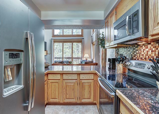 The open kitchen has plenty of counter space to make a feast for your family.