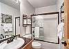 Upper level hallway bathroom shared between the master bedroom and the loft. 