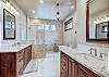 Large primary master bathroom with Jack and Jill vanity sinks and a shower room with soaking tub - Breck Escape Breckenridge Vacation Rental  