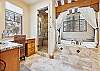 The bathroom attached to the main bedroom boasts a jetted tub and steam shower, Snow Mansion, Breckenridge Vacation Rental