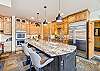 The kitchen includes an island that seats three, Snow Mansion, Breckenridge Vacation Rental