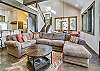 Cozy living area with ample natural light - Highwood Hideaway Breckenridge Vacation Rental