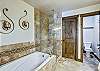 Large soaking tub and walk in shower - master bathroom - Highwood Hideaway Breckenridge Vacation Rental