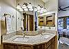 Lower level master bathroom with dual vanity sinks - Highwood Hideaway Breckenridge Vacation Rental