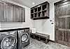 Lower level laundry room with full size washer dryer, cubbies, and garage entry- Breckenridge Vacation Rental