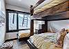 Lower level bunk room with Full over Queen bunks plus Twin-size bed and TV- Breckenridge Vacation Rental