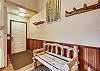 Entryway area with coat hooks and bench - Cedars 53 Breckenridge Vacation Rental