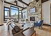 Feel comfortable and welcomed in the living room with an abundance of natural light - Barton Creek Vista Breckenridge Vacation Rental 