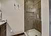 This bathroom offers a luxury walk in shower - Barton Creek Vista Breckenridge Vacation Rental 
