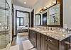 Master bathroom with double vanity sinks, walk in shower, and soaking tub - Barton Creek Vista Breckenridge Vacation Rental 