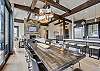 View of the dining area overlooking the kitchen and living area - Barton Creek Vista Breckenridge Vacation Rental 