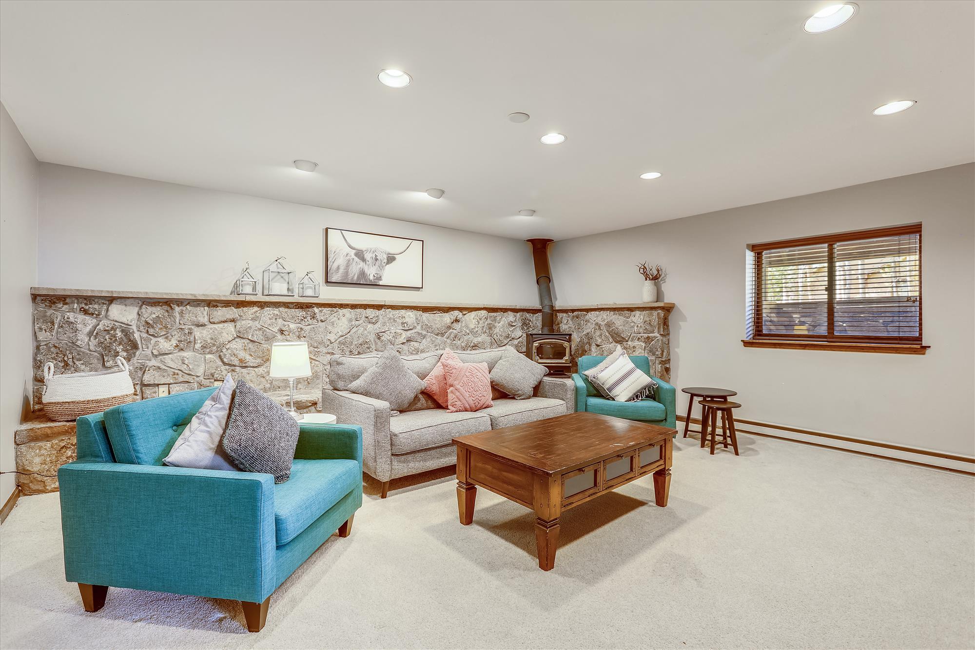 Bottom floor family room with vented stove - Calderon De La Breck Breckenridge Vacation Rental