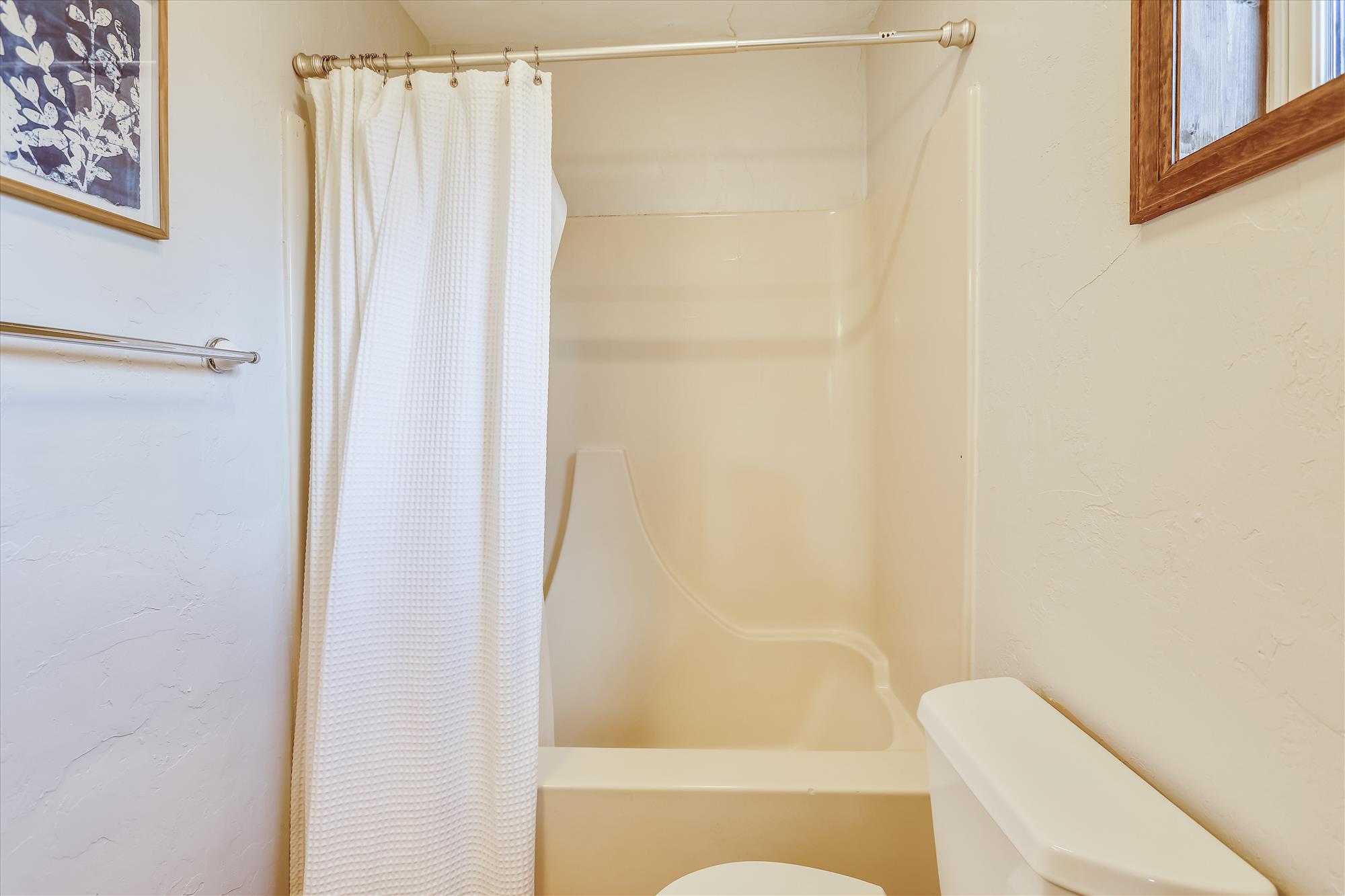 This en-suite features a shower/tub combo - Calderon De La Breck Breckenridge Vacation Rental