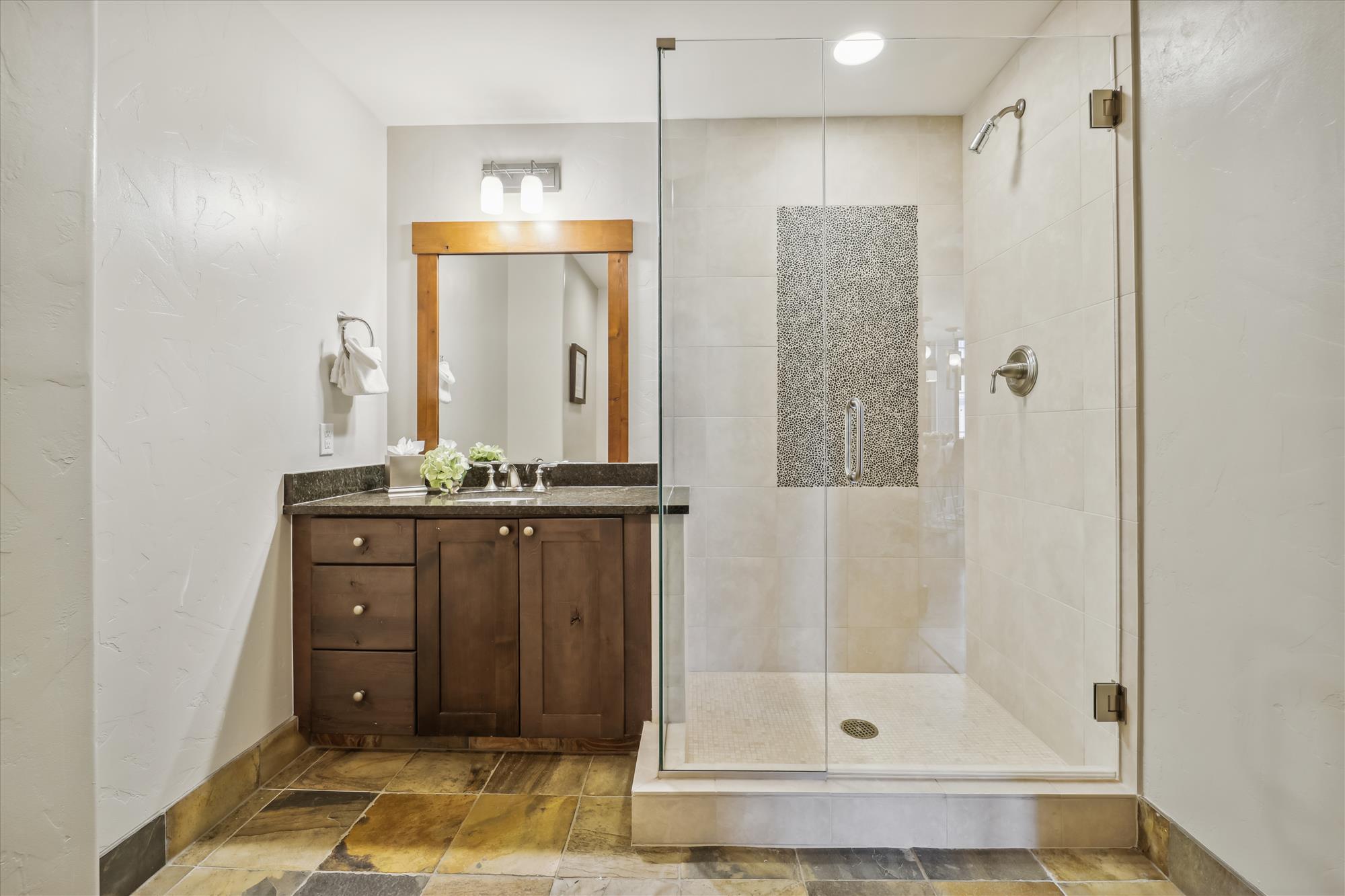 Shared bathroom with walk-in shower
