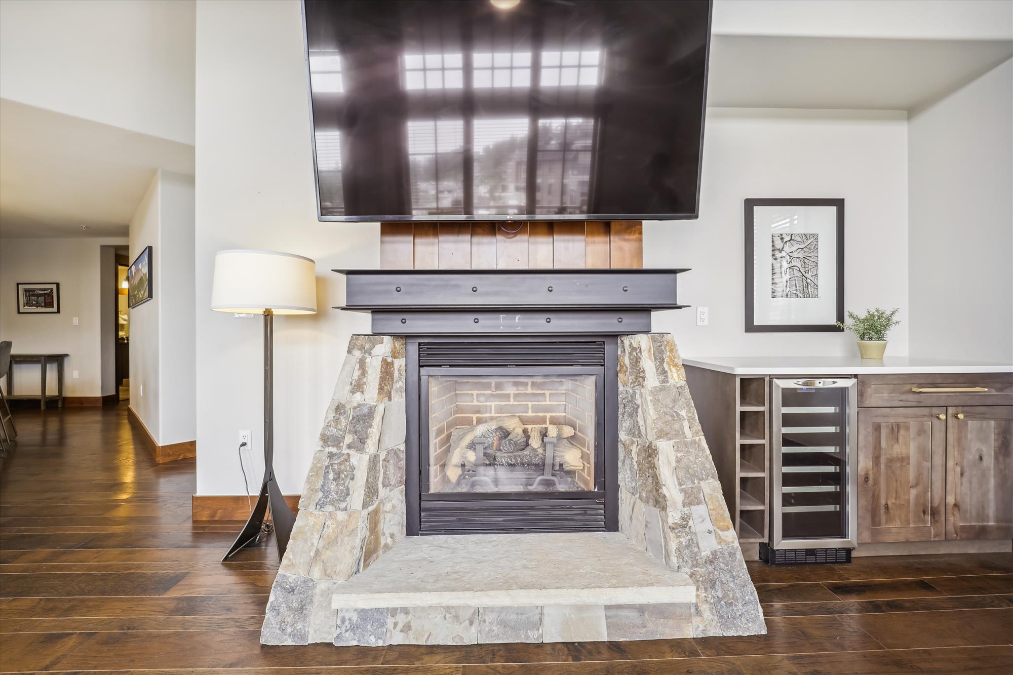 Living area fireplace and TV - One Ski Hill Place 8424-Breckenridge Vacation Rental