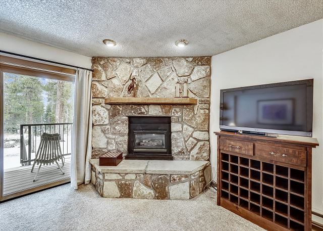 Watch your favorite movies and shows on this flat screen TV - Atrium 003 Breckenridge Vacation Rental