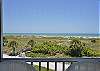 Relaxing balcony with ocean view in Florida beachfront condo, perfect for a wedding party's stay.