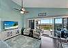 Elegant living room with ocean view in Palm Island beach house, ideal for beachfront rentals.