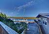 Second floor balcony overlooks the dock on a deep water river with excellent fishing!