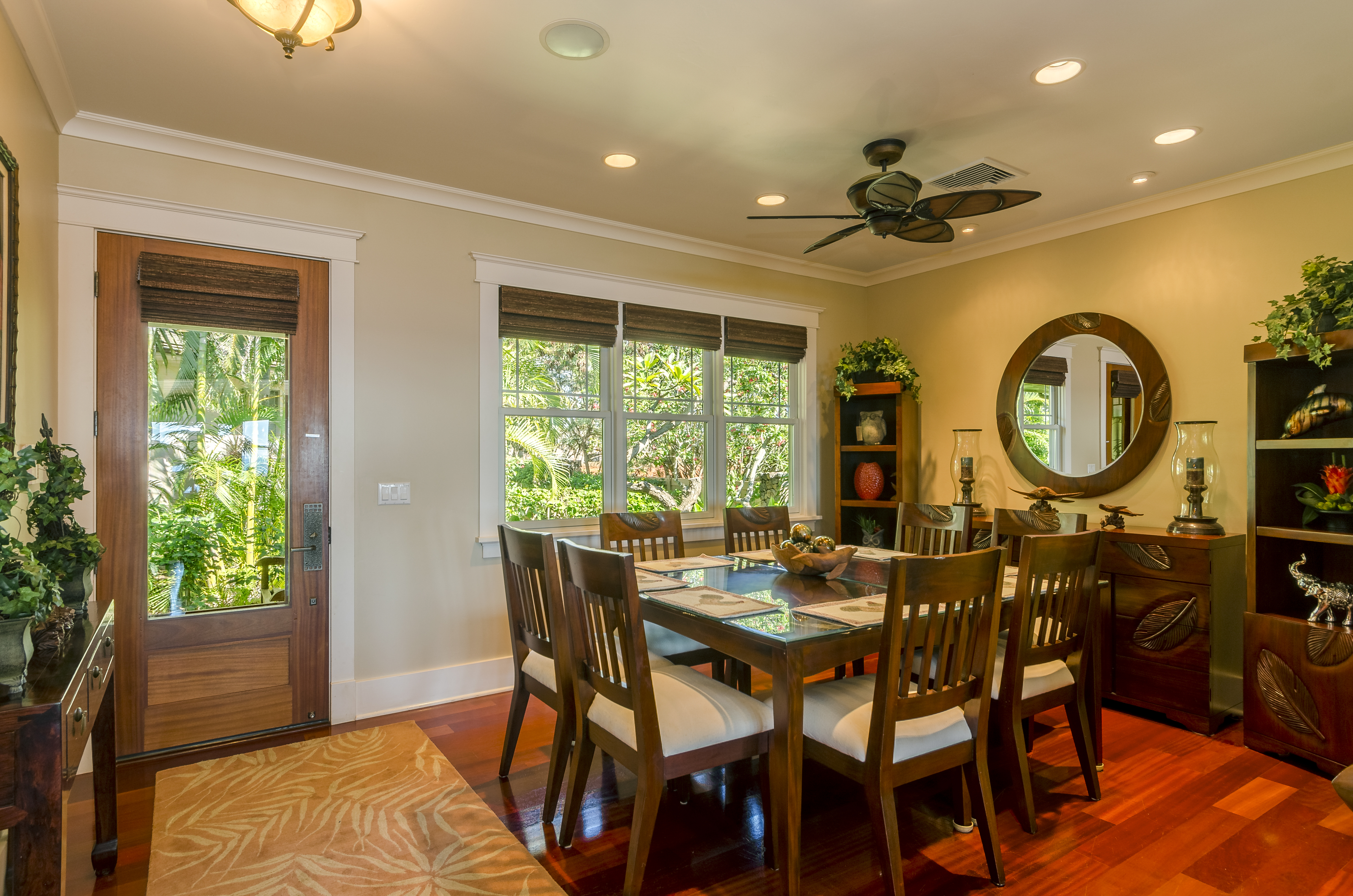 The back door opens to the dining area, with a table and seating for eight, with lush garden views. 