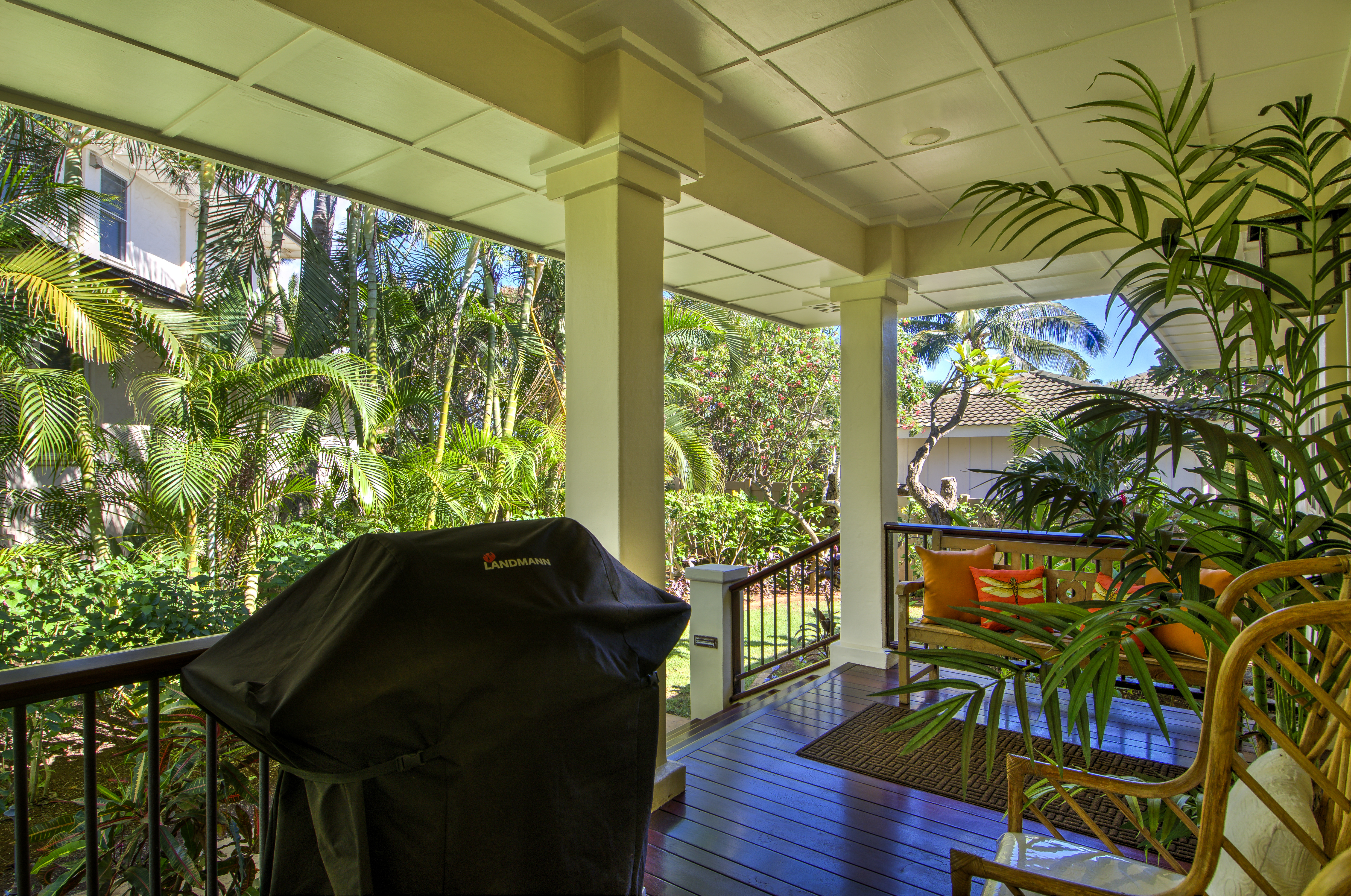 From the back entry, Honu La'e has a covered porch with plenty of seating and a BBQ grill.