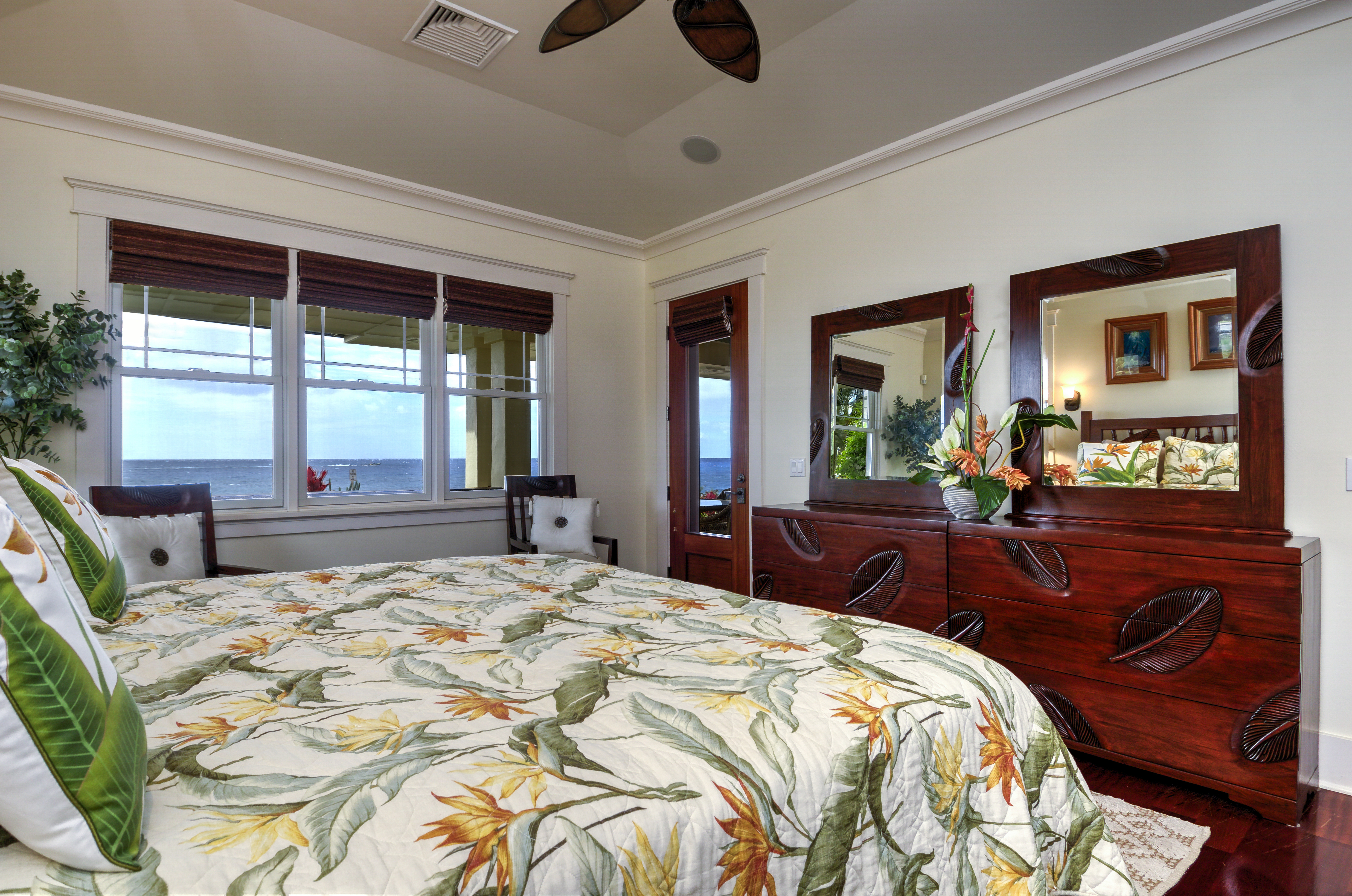 Honu La'e master bedroom is off the front of the house with ocean views, has an large ensuite bathroom, and opens to the living room.