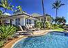 Luxurious Honu' La'e with relaxing pool, lounge chairs, and gorgeous manicured lawn.
