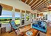 Ocean views from every angle of the living space, dining table and kitchen at Koa Cottage.