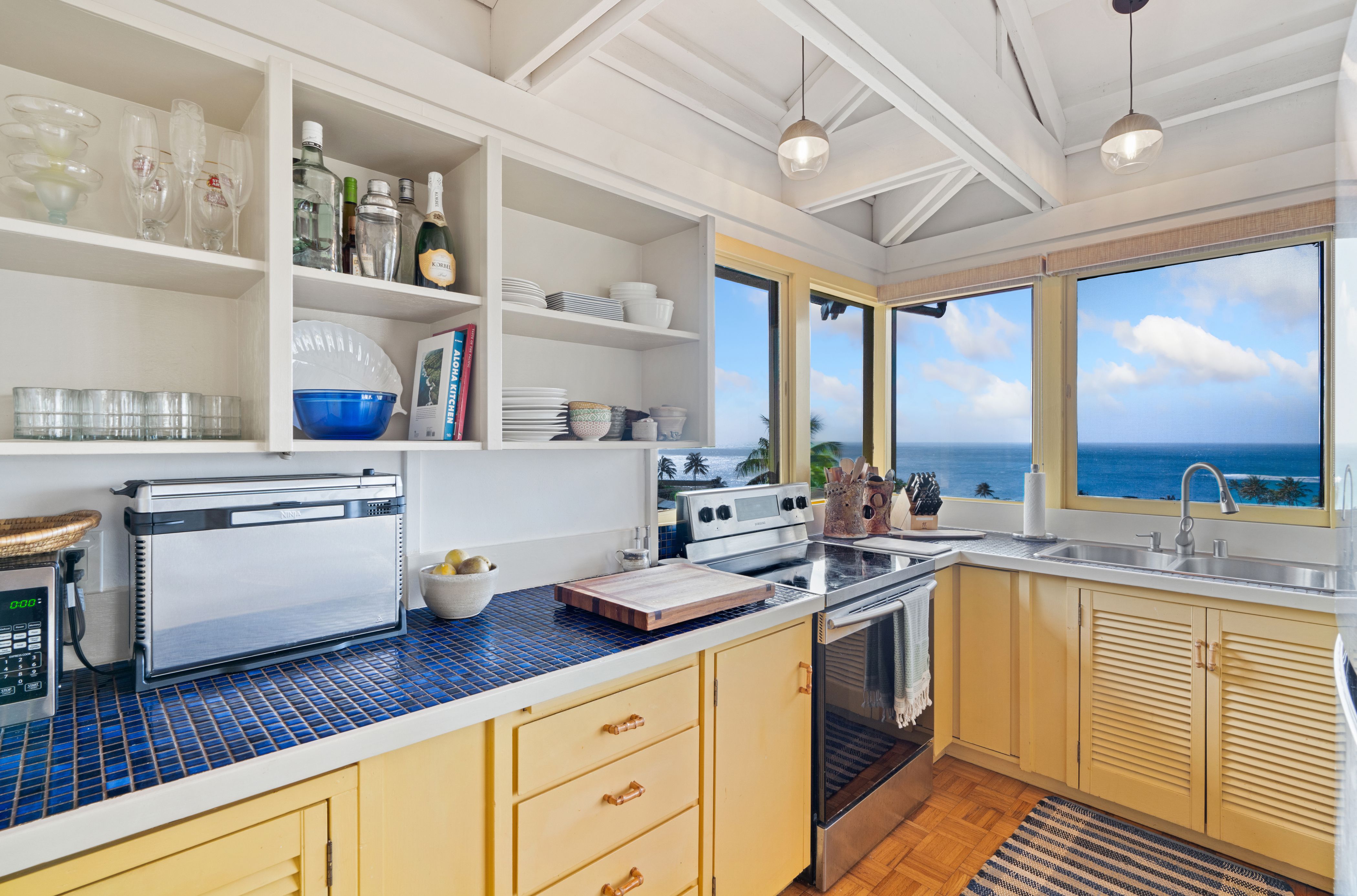 Well stocked kitchen with sunrise and sunset views is great for your friends and family