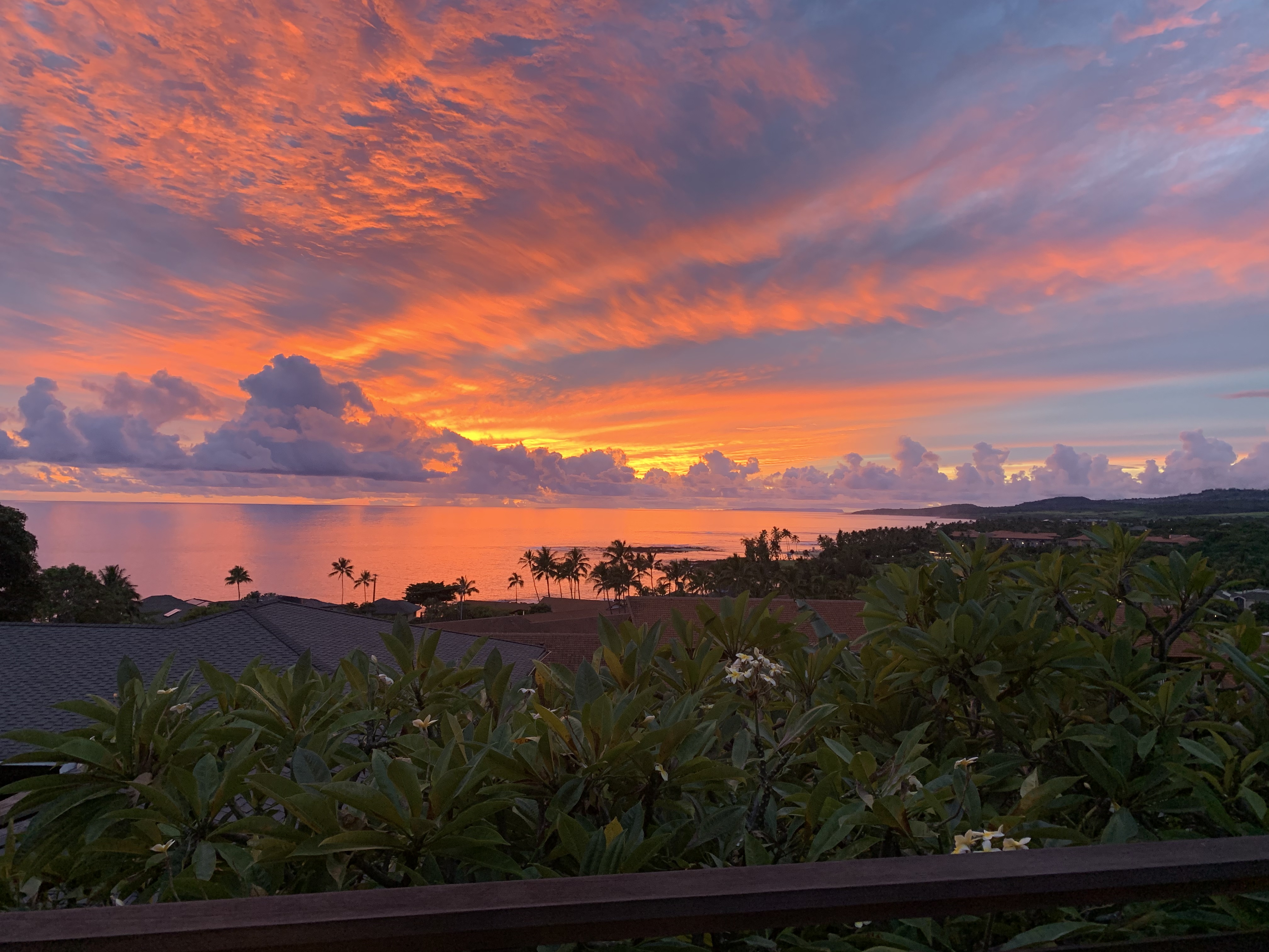 Amazing Views Hale 2nd Story Lanai View - breathtaking sunset colors reflected in calm Pacific waters.