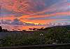 Amazing Views Hale 2nd Story Lanai View - breathtaking sunset colors reflected in calm Pacific waters.