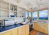 Well stocked kitchen with sunrise and sunset views is great for your friends and family