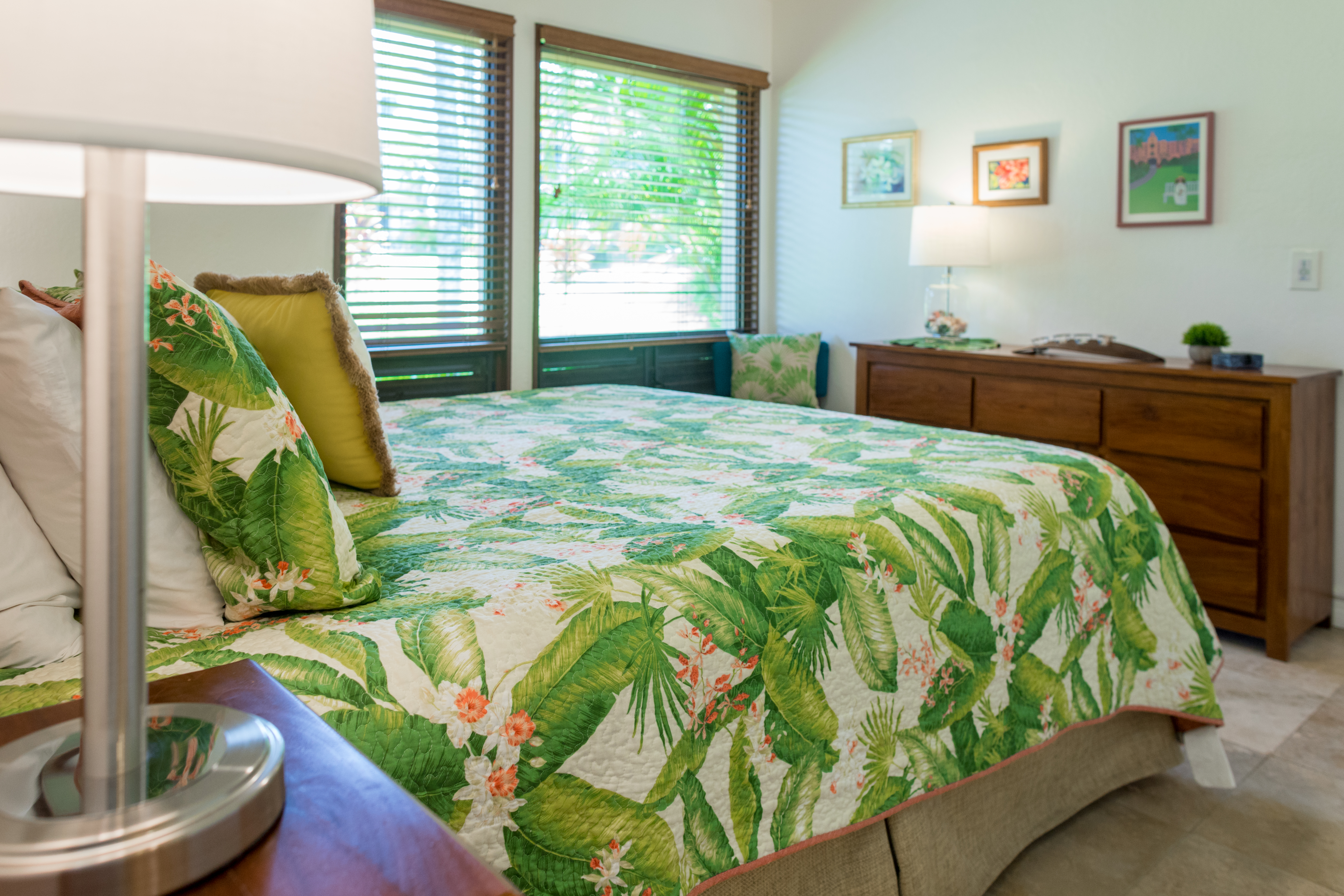 Kahala 312 Master Bedroom with garden view and modern, tropical decor.