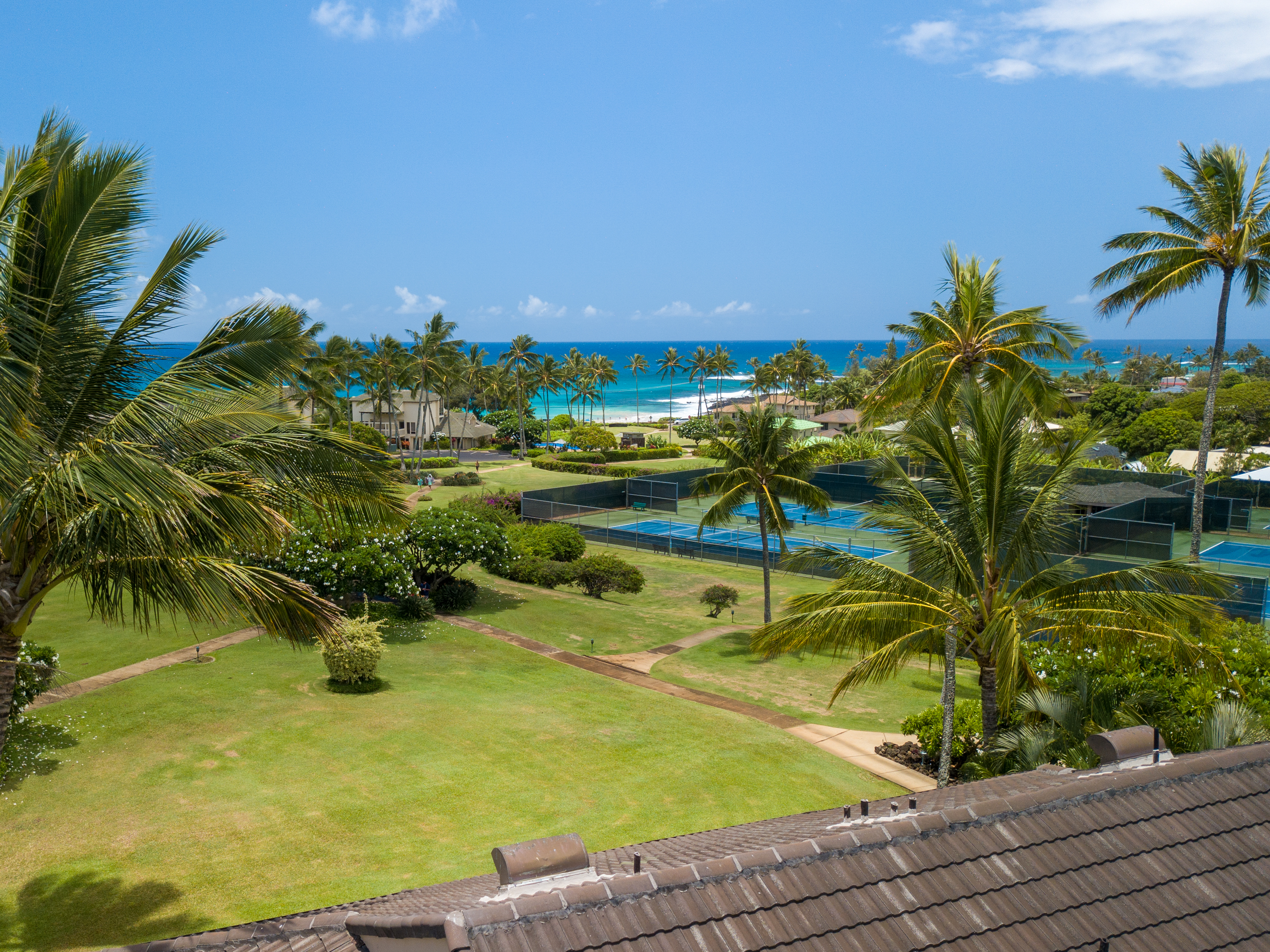 A birdseye view from the Kahala 312 rooftop - just a short walk from the tennis courts, and world-class Poipu beach!