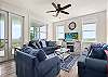 Spacious living room with windows looking into the gulf 