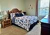 Queen bed in guest bedroom
