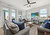 Spacious living room with large windows looking out into the gulf