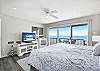 Upstairs bedroom with outstanding ocean views, king bed & smart TV