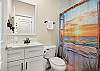 Hall bathroom with shower/tub combo 