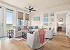 Living room is spacious with comfortable furniture 