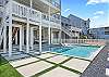 This perfectly groomed backyard offers privacy as well as shade and nice landscaping. 
