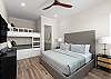 King bedroom with full over full bunk and an en suite bathroom. 