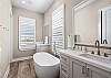 Ensuite to the bedroom, this private haven offers a huge walk in shower and soaking tub. Perfect for letting your cares melt away. 