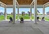 Chairs on the ground level to relax while you grill outside! 