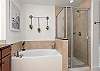 Large soak tub and walk-in shower.
