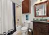 En suite bathroom with shower/tub combo 