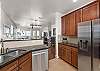 Fully equipped kitchen with stainless steel appliances. 