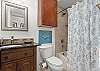 Hall bathroom with shower/tub combo 