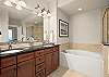 Double sinks and soak tub in master bathroom 