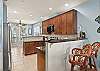 Bar seating on both sides of the kitchen